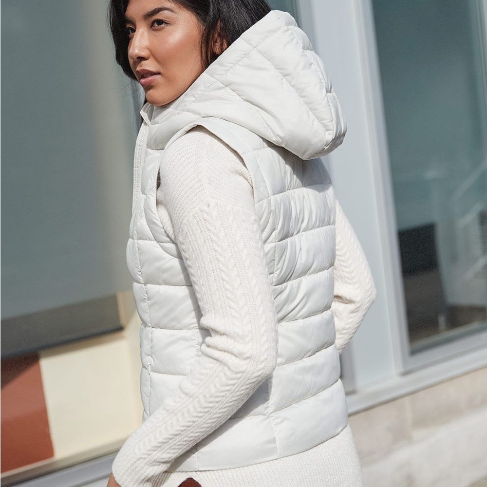 White puffer vest with fur-lined hood